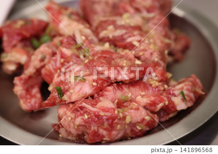 Marinated Raw Beef Slices with Sesame Seeds and Green Onions 141896568