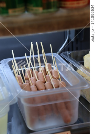Skewered Sausages in Clear Plastic Container 141896634