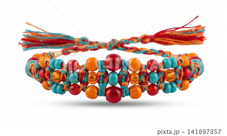 Handmade braided friendship bracelet with multi-colored beads and tassels bracelet handmade bohemian accessory colorful turquoise wristband close-up adornment decorative tradition wearable Handmade braided friendship bracelet with multi-colored beads and tassels bracelet handmade bohemian accessory colorful turquoise wristband close-up adornment decorative tradition wearable 141897857