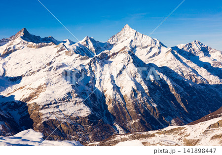 Winter landscape of mountain peaks located near the of Zermatt Winter landscape of mountain peaks located near the of Zermatt 141898447