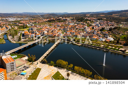 Aerial view of Mirandela with fountain and bridges crossing Tua river, Portugal 141898504