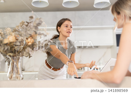 An insurance agent tells young girl the terms of property and life insurance 141898569