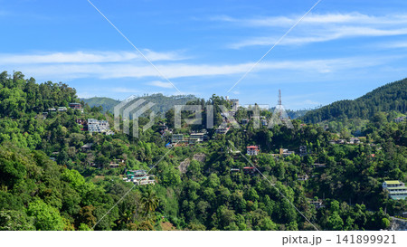 Hillside deforestation and urban development with houses and hotels expanding into forested mountains in Nuwara Eliya, Sri Lanka Hillside deforestation and urban development with houses and hotels expanding into forested mountains in Nuwara Eliya, Sri Lanka 141899921