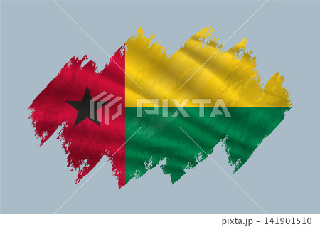 Guinea Bissau flag is depicted with brushstrokes and features textured design elements. 141901510