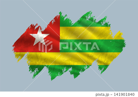 Togo flag is depicted with brushstrokes and features textured design elements. Togo flag is depicted with brushstrokes and features textured design elements. 141901840