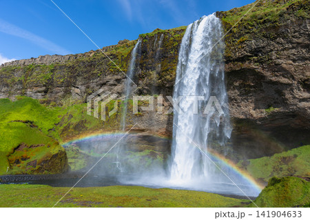 Seljalandsfoss waterfall with rainbow in Iceland Seljalandsfoss waterfall with rainbow in Iceland 141904633