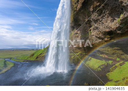 Seljalandsfoss waterfall with rainbow in Iceland Seljalandsfoss waterfall with rainbow in Iceland 141904635