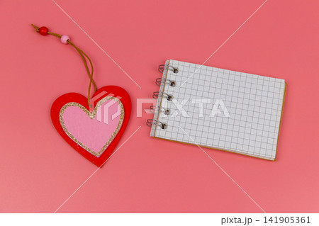 Heart and blank notepad on pastel pink background. Top view, flat lay. Valentine Day concept 141905361