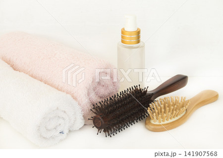 serum, brush comb health care for hairs and terry cloth of lifestyle woman serum, brush comb health care for hairs and terry cloth of lifestyle woman 141907568