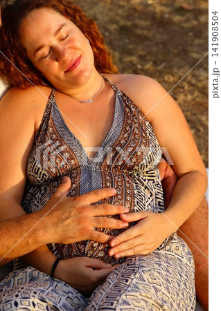 Pregnant Woman Enjoying a Peaceful Outdoor Moment 141908504