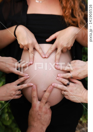 Pregnant Woman Enjoying a Peaceful Outdoor Moment 141908516