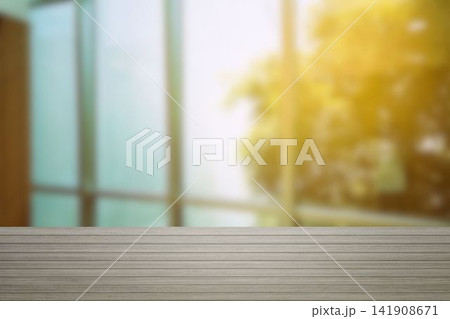 Wooden table top with blurred window and sunlight interior background for professional product presentation. 141908671