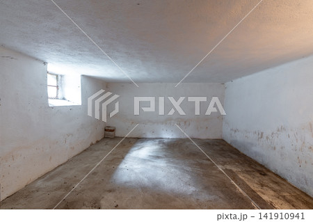 Empty concrete room showing isolation and damp conditions Empty concrete room showing isolation and damp conditions 141910941