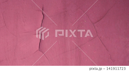 Cracked wall texture painted pink 141911723