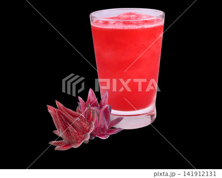 Refreshing red roselle drink in a glass, garnished with fresh roselle flowers, natural Thai herbal beverage  on back background. 141912131