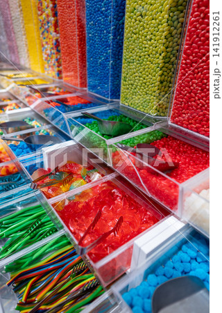 showcase of candy shop, transparent container with various sweets, marshmallow, jelly, chewy gums, rich sugar assortment showcase of candy shop, transparent container with various sweets, marshmallow, jelly, chewy gums, rich sugar assortment 141912261