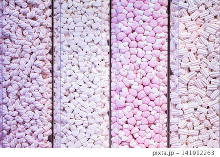 showcase of candy shop, transparent container with various sweets, marshmallow, jelly, chewy gums, rich sugar assortment 141912263