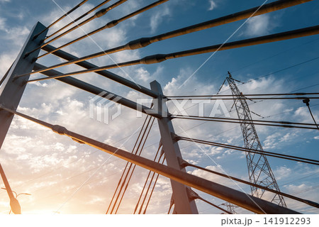 modern metal cable bridge imeni Kaczorowskiego on blue sky background, Lublin modern metal cable bridge imeni Kaczorowskiego on blue sky background, Lublin 141912293