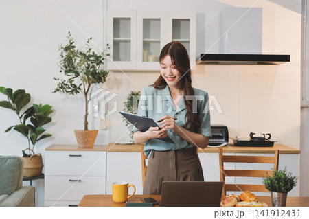 Young adult asian business woman using laptop chat digital artificial intelligence assistance ai chatbot prompt analysis work modern lifestyles 141912431