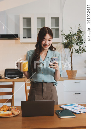 Young adult asian business woman using laptop chat digital artificial intelligence assistance ai chatbot prompt analysis work modern lifestyles 141912432