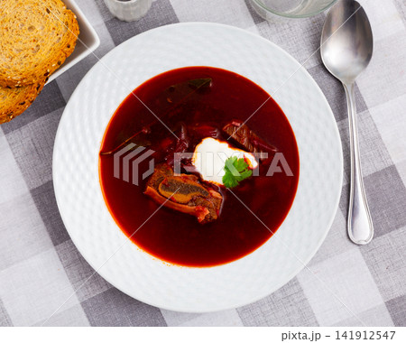 Just prepared portion of svekolnik served with parsley and smetana Just prepared portion of svekolnik served with parsley and smetana 141912547