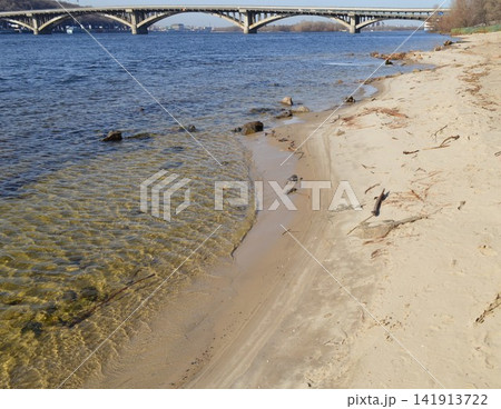 The bank of the Dnipro River, a wild sandy beach in the Hydropark The bank of the Dnipro River, a wild sandy beach in the Hydropark 141913722