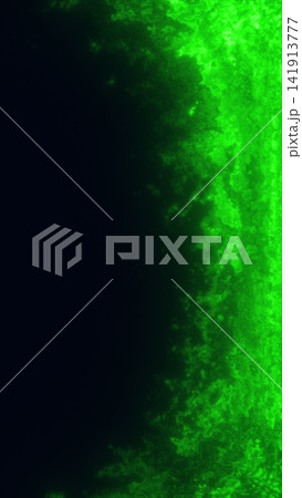 Glowing green plasma edge with dark copy space, smoky cosmic texture, and mysterious futuristic energy atmosphere. Glowing green plasma edge with dark copy space, smoky cosmic texture, and mysterious futuristic energy atmosphere. 141913777
