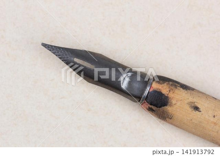 Fountain pen on an antique textured paper. Fountain pen on an antique textured paper. 141913792