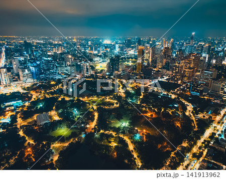 Bangkok city aerial skyline view with Lumpini Park nightscape, night cityscape of Bangkok with illuminated modern urban park and high-rise skyscrapers of Thailand Bangkok city aerial skyline view with Lumpini Park nightscape, night cityscape of Bangkok with illuminated modern urban park and high-rise skyscrapers of Thailand 141913962