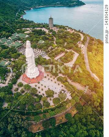 religious Lady Buddha monument at Linh Ung pagoda and buddhism temple in Danang, Asian religion and spirituality, Son Tra peninsula, Da Nang Vietnam, aerial drone view religious Lady Buddha monument at Linh Ung pagoda and buddhism temple in Danang, Asian religion and spirituality, Son Tra peninsula, Da Nang Vietnam, aerial drone view 141914129