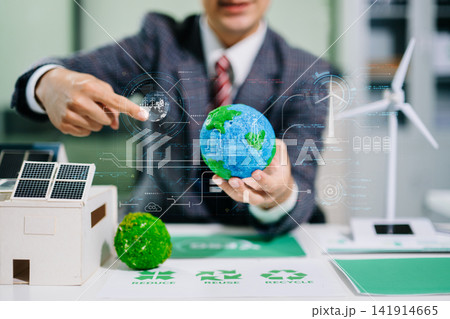 Business team working virtual modern smartphone to reduce CO2 emissions carbon footprint climate change Business team working virtual modern smartphone to reduce CO2 emissions carbon footprint climate change 141914665