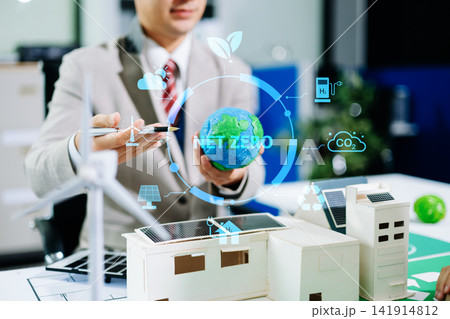 Business team working virtual modern smartphone to reduce CO2 emissions carbon footprint climate change to limit global warming.Sustainable development and green business concept. at office 141914812
