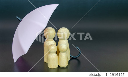 Light pink umbrella shielding wooden figures as a concept of leadership, risk management and security protection Light pink umbrella shielding wooden figures as a concept of leadership, risk management and security protection 141916125