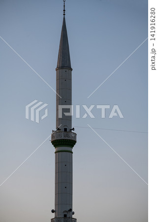Antalya, Turkey, July 2026: Close-up view of a mosque minaret against the evening sky Antalya, Turkey, July 2026: Close-up view of a mosque minaret against the evening sky 141916280