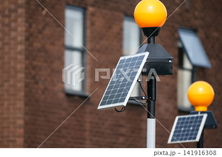 Solar-powered warning lights with photovoltaic panels outside the airport 141916308