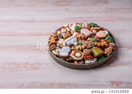 Gingerbread as a Christmas staple, sweets for the holiday interior. Gingerbread as a background Gingerbread as a Christmas staple, sweets for the holiday interior. Gingerbread as a background 141918889