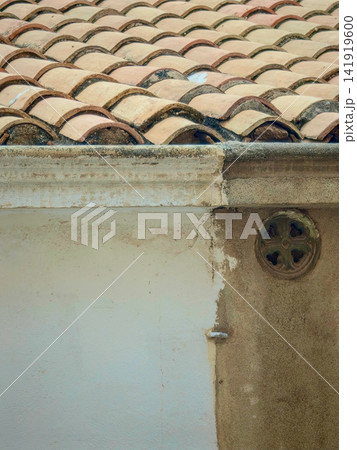 Traditional terracotta roof tiles showing architectural details 141919600
