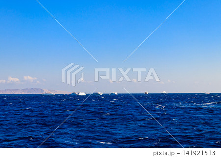View of Red sea and white yachts on horizon near Hurghada, Egypt 141921513