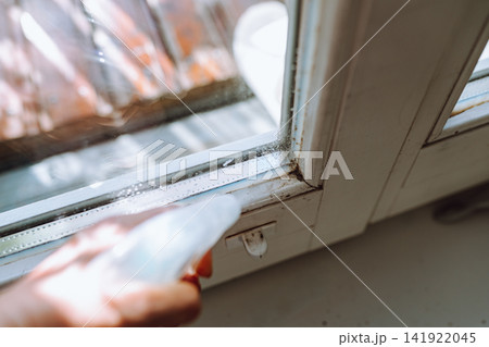 Black mold on window silicone sealant 141922045