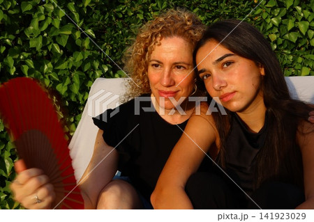 Mother and Daughter Portrait Sharing a Tender Family Moment Mother and Daughter Portrait Sharing a Tender Family Moment 141923029
