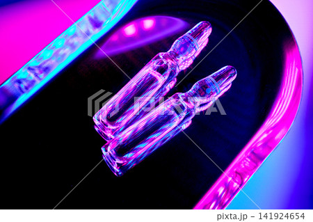 Weight loss innovation vials glowing with neon light Weight loss innovation vials glowing with neon light 141924654