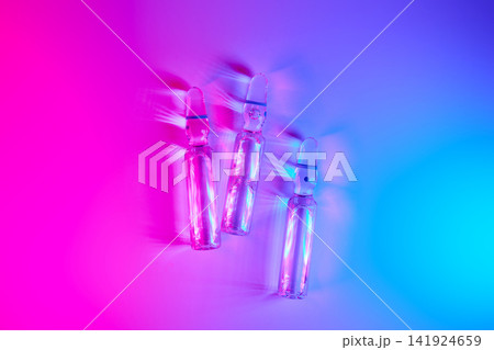 Medical ampoules showcasing weight loss innovation in neon light 141924659
