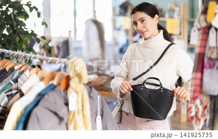 Armenian woman chooses a fashionable handbag 141925735