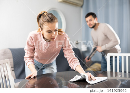 Man and woman cleaning up at home Man and woman cleaning up at home 141925962