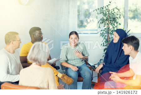 Young girl discussing volunteer project with group of like-minded people Young girl discussing volunteer project with group of like-minded people 141926172