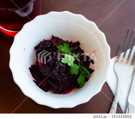 Salad of grated boiled beets with olive oil and greens Salad of grated boiled beets with olive oil and greens 141926668