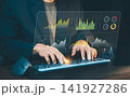 Businessman typing on computer keyboard with interactive financial analytics dashboard interface, stock market research and big data visualization. 141927286