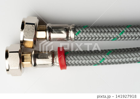 Close up of metal and braided hoses for plumbing use 141927918