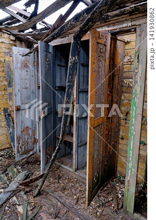 Old lockers with peeling colorful paint inside a ruined and abandoned railway carriage Old lockers with peeling colorful paint inside a ruined and abandoned railway carriage 141930862
