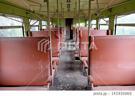Empty rows of brown leather seats inside an abandoned vintage train carriage Empty rows of brown leather seats inside an abandoned vintage train carriage 141930868